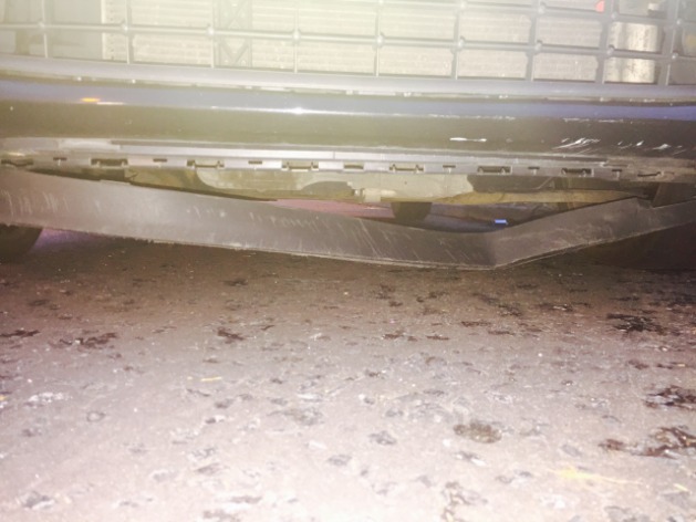Plastic hanging from underneath front of Ford Fiesta - 1