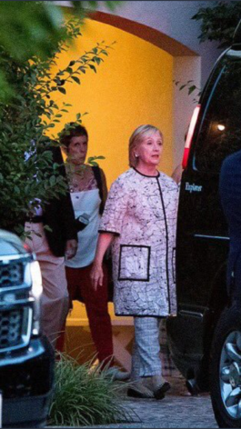 Dose the person behind Hillary dressed in a. Blanket with pockets look familiar to you