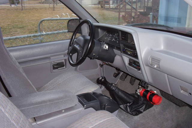 Where is the parking brake, 92 explorer 5 spd - 1